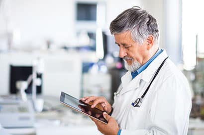 Image of neurofeedback provider working on a tablet